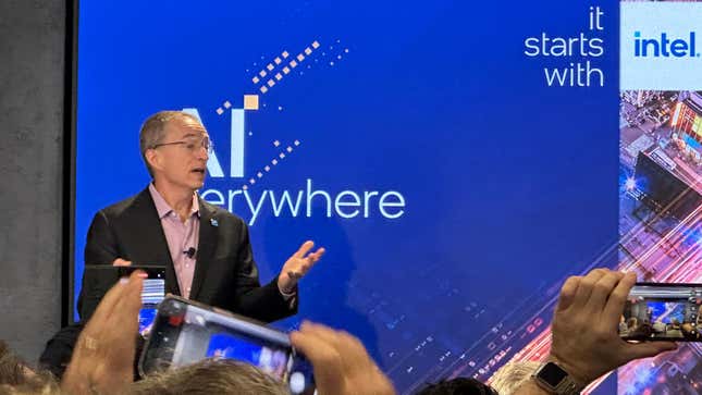 Pat Gelsinger standing in front of a screen showing AI everwhere and the Intel logo.