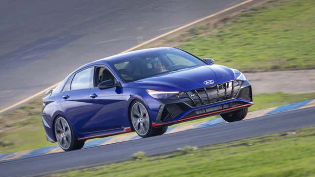 A photo of a blue Hyundai Elantra N on the track. 