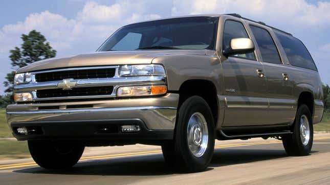 A photo of a gold Chevrolet Suburban SUV. 