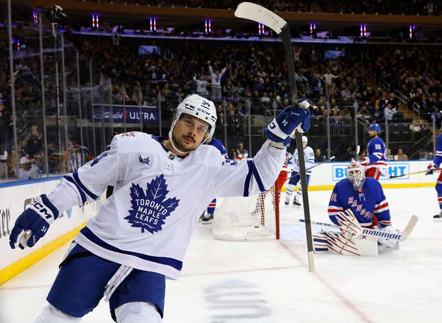 NEW YORK, NEW YORK - DECEMBER 12: Auston Matthews #34 of the Toronto Maple Leafs scores at 3:52 of the first period against Igor Shesterkin #31 of the New York Rangers at Madison Square Garden on December 12, 2023 in New York City. (Photo by Bruce Bennett/Getty Images)