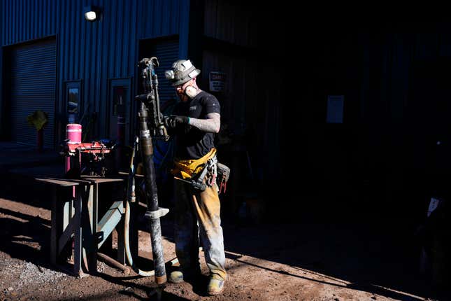 A woker checks on a piece of mining equipment at the Energy Fuels Inc. uranium Pinyon Plain Mine Wednesday, Jan. 31, 2024, near Tusayan, Ariz. The largest uranium producer in the United States is ramping up work just south of Grand Canyon National Park on a long-contested project that largely has sat dormant since the 1980s. (AP Photo/Ross D. Franklin)