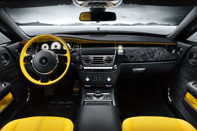 The dashboard and yellow seats of a Rolls-Royce Wraith