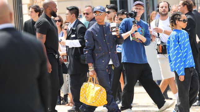 Pharrell Williams carrying a Millionaire Speedy bag
