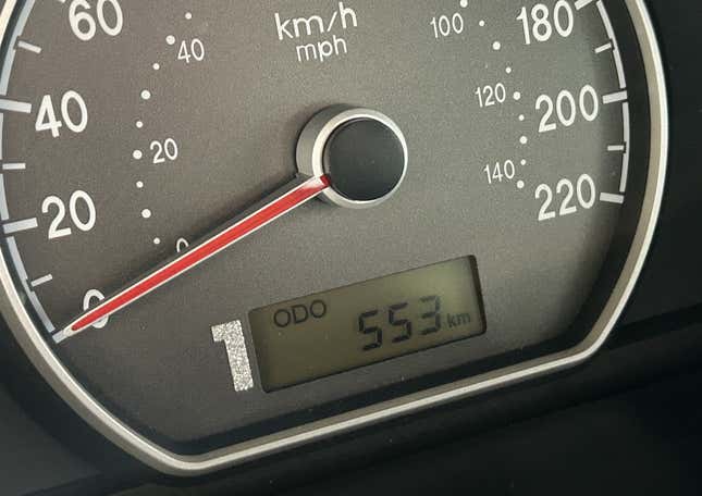 A photo of the odometer showing the number 1 painted in front of the digital odometer screen