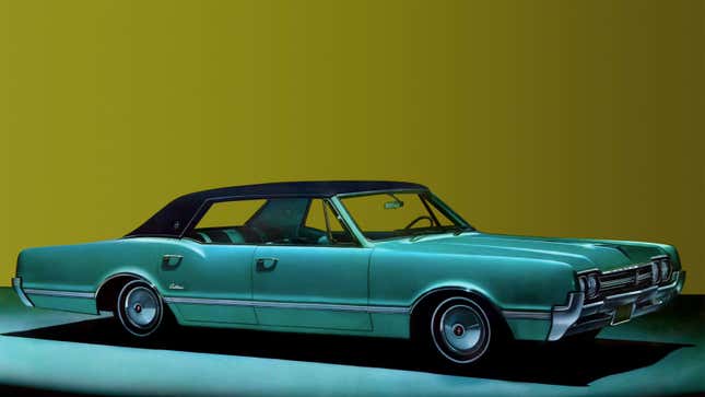 A green Oldsmobile Cutlass Supreme 