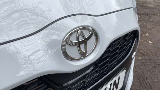 A photo of the front of a white Toyota Yaris GR Sport. 