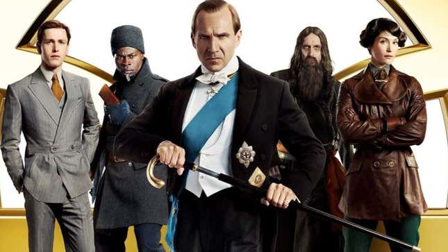 A grumpy, tuxedo-ed Ralph Fiennes stands in from of a leather jacket-clad Gemma Arterton, Rasputin, and other.
