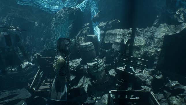 Lune stands admist a bunch of barrels and discarded materials.