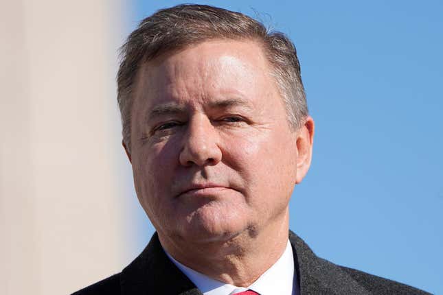 FILE - Oklahoma Attorney General Gentner Drummond stands during the playing of the national anthem at the inauguration ceremonies, Jan. 9, 2023, in Oklahoma City. Drummond filed lawsuits on Wednesday, April 10, 2024, against two Texas-based natural gas companies over their role in soaring gas prices during Winter Storm Uri in 2021. (AP Photo/Sue Ogrocki, File)