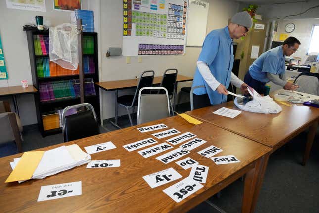 Michael Moore, left, and Steven Joyner, work in the classroom of the Peer Literacy Mentor Program at San Quentin State Prison in San Quentin, Calif., on March 17, 2023. California Gov. Gavin Newsom has ambitious and expensive plans for a dilapidated factory at San Quentin State Prison where inmates of one of the nation&#39;s most notorious lockups once built furniture. He wants to spend $360 million demolishing the building and replacing it with one more reminiscent of a college campus, with a student union, classrooms and possibly a coffee shop. (AP Photo/Eric Risberg)