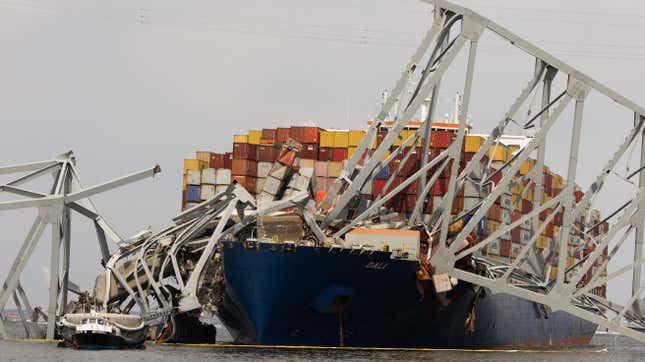 Wreckage from the collapsed Francis Scott Key Bridge rests on the Dali cargo ship as efforts begin to clear the debris and reopen the Port of Baltimore on March 30, 2024, in Baltimore, Maryland. 