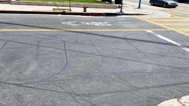 A photo of some ellipse-shaped induction loops on a road in Los Angeles, CA