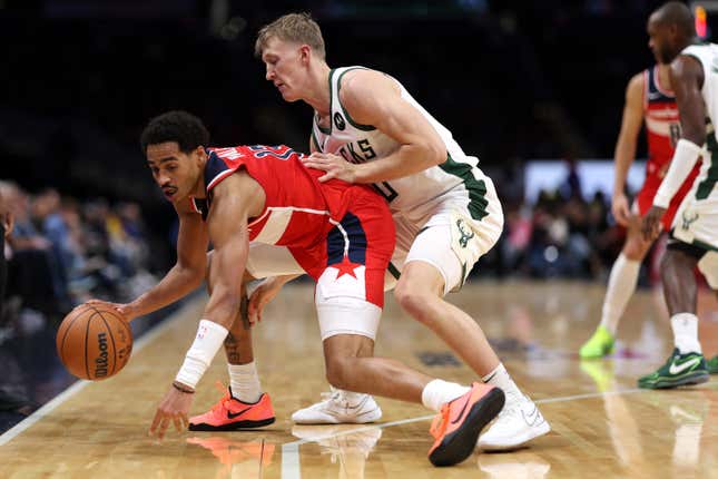 Jordan Poole (left) has been a huge bust in Washington.