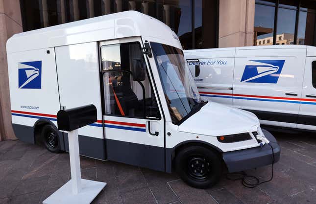 The United States Postal Service unveils two of its battery-powered vehicles at an event announcing its plan on implementing electric vehicles, at the Postal Service Headquarters on December 20, 2022 in Washington, DC. The U.S. Postal Service announced it intends to deploy over 66,000 electric vehicles by 2028. 