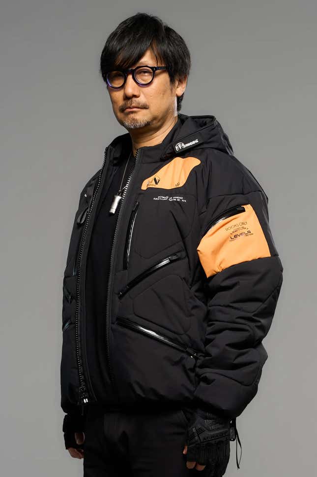 1) Sleek limited edition Death Stranding 2 jacket displayed on a bust2) Close-up of the high-quality stitches and fabric of the Death Stranding 2 jacket3) Detailed view of the unique Death Stranding 2 logo on the jacket 4) Lifestyle shot of a model posing in the stylish Death Stranding 2 jacket 5) New Death Stranding 2 jacket paired with matching game accessories.6) Hero shot of the Death Stranding 2 jacket, highlighting its exclusive design.