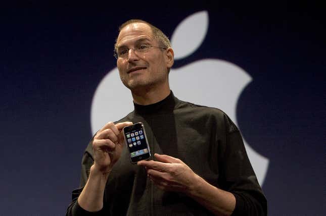 Apple CEO Steve Jobs holds up the new iPhone that was introduced at Macworld on January 9, 2007 in San Francisco, California. 