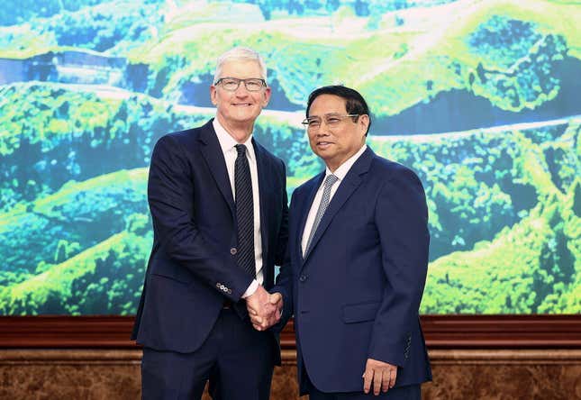 Apple CEO Tim Cook, left, shakes hands with Vietnamese Prime Minister Pham Minh Chinh in Hanoi, Vietnam on Tuesday, April 16, 2024. The tech giant CEO is on a visit to Vietnam to promote cooperation and boost investment in the Southeast Asian nation. (Duong Van Giang/VNA via AP)