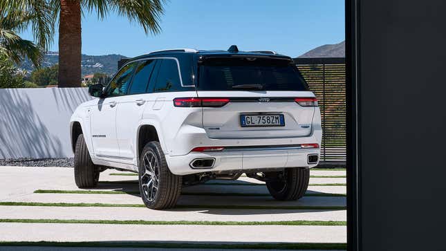 White Jeep Grand Cherokee 4xe rear-quarter view.