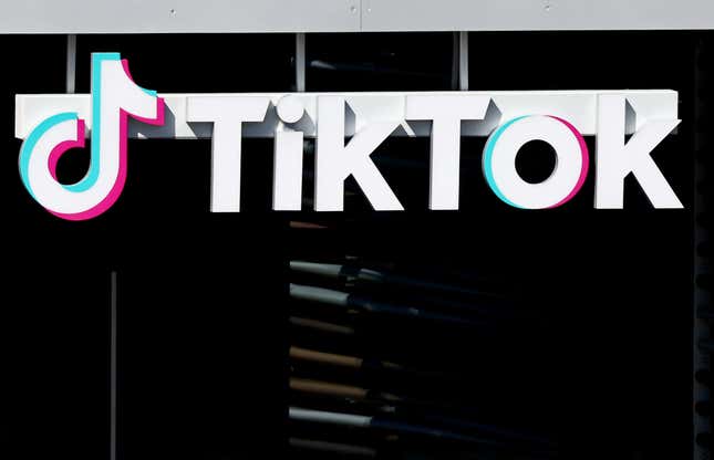 TikTok logo hanging over a building