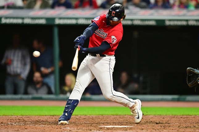 Cleveland Guardians' Kole Calhoun scores against the Tampa Bay