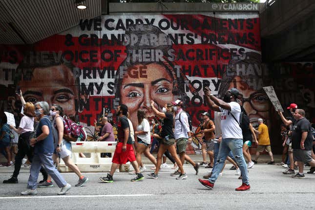  People march to the Georgia State Capitol during a Juneteenth event Organized by the One Race Movement on June 19, 2020, in Atlanta, Georgia. Juneteenth commemorates June 19, 1865, when a Union general read orders in Galveston, Texas, stating all enslaved people in Texas were free according to federal law. 