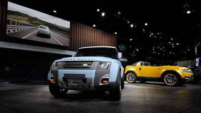 A photo of two Land Rover concept cars on display at an auto show. 