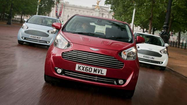 A photo of three Aston Martin Cygnet hatchbacks. 