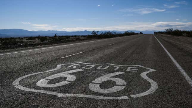 A photo of a Route 66 sign on a US highway. 