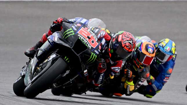 A photo of three Moto GP racers in Portugal. 