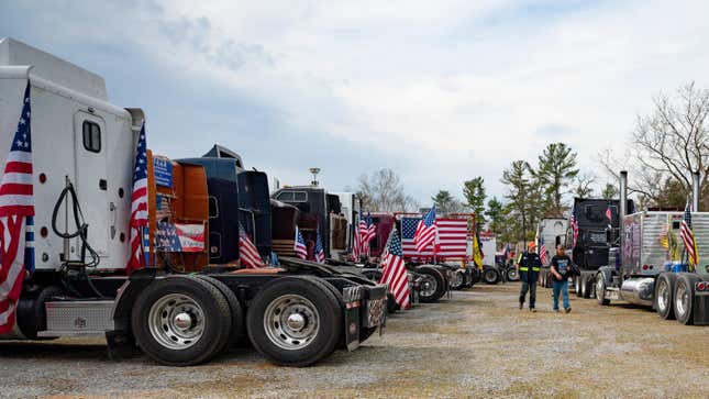 Demonstrators prepare to depart Hagerstown Speedway in Hagerstown, Maryland, on March 7, 2022, during “The People’s Convoy” event. - The convoy has called on U.S. President Joe Biden to end vaccine and other COVID-19 pandemic mandates while modeling themselves after Canadian drivers who had occupied the center of Ottawa in a similar protest. 