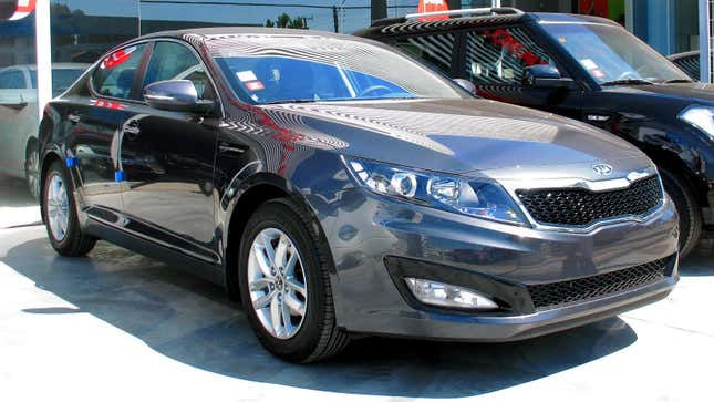 a dark grey 2011 Kia Optima 2.0 EX