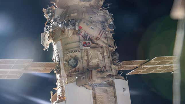 Cosmonauts Oleg Artemyev and Denis Matveev of Roscosmos are pictured attached to the Nauka multipurpose laboratory module during a spacewalk on April 28, 2022, to activate the European robotic arm on the International Space Station.