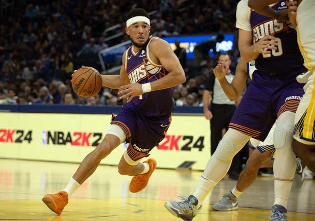 Oct 24, 2023; San Francisco, California, USA; Phoenix Suns guard Devin Booker (1) drives to the basket against the Golden State Warriors during the second quarter at Chase Center.