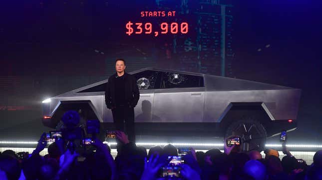 Tesla co-founder and CEO Elon Musk stands in front of the newly unveiled all-electric battery-powered Tesla's Cybertruck at Tesla Design Center in Hawthorne, California on November 21, 2019