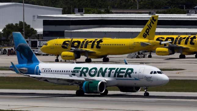 A Frontier Airlines plane near a Spirit Airlines plane at the Fort Lauderdale-Hollywood International Airport on May 16, 2022 in Fort Lauderdale, Florida.