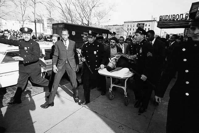  Two policemen carry stretcher bearing Negro nationalist leader Malcom X after he was downed by an assassin’s bullets at a rally February 21st. The 39-year-old Malcolm was pronounced dead at hospital when he was taken for treatment. The assination of the one-time Muslim official came one week after the bombing of his home February 13th.