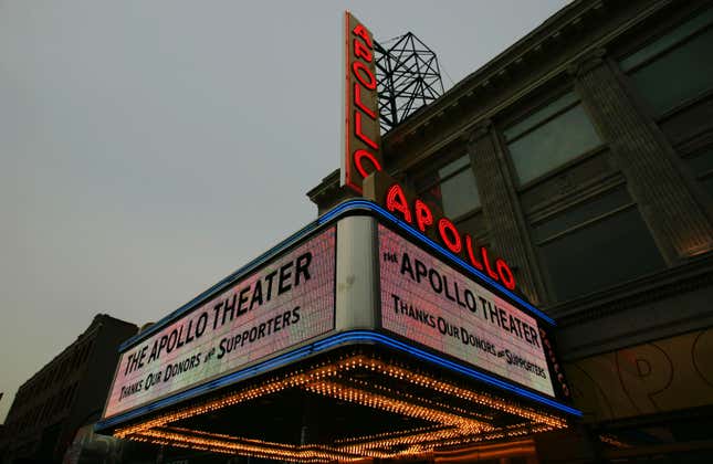  A new marquee and vertical sign for Harlem’s Apollo Theater is illuminated for the first time December 15, 2005 in New York City.