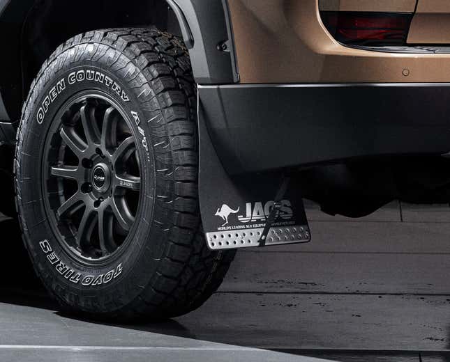 Detail shot of the wheels and mudflaps of a modified Lexus GX