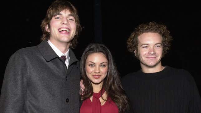 That ‘70s Show cast members Ashton Kutcher, Mila Kunis, and Danny Masterson arrive at a film premiere in 2000.