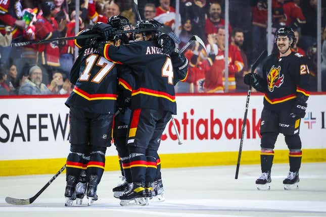 Nov 18, 2023; Calgary, Alberta, CAN; Calgary Flames center Yegor Sharangovich (17) celebrates his goal with teammates against the New York Islanders during the third period at Scotiabank Saddledome.