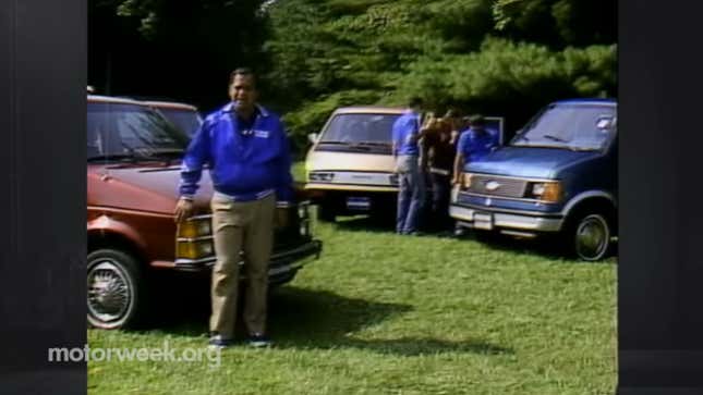 A screenshot from the youtube video with the plymouth, chevy, and toyota vans parked on grass with people around them