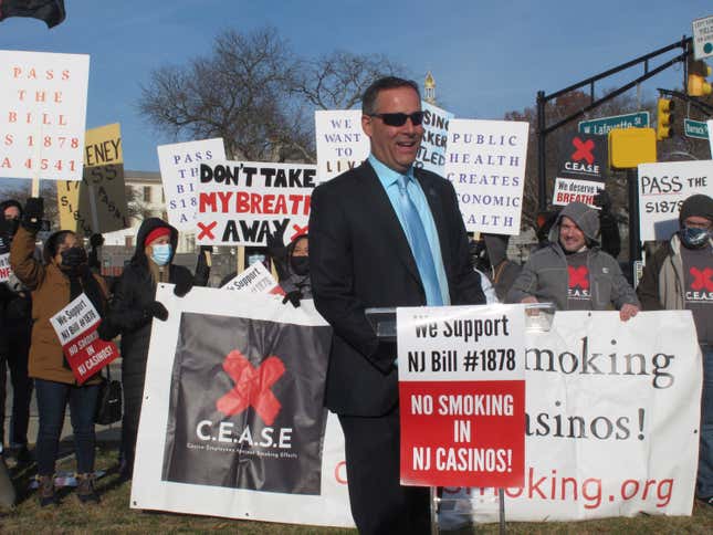 FILE - New Jersey state Senator Vince Polistina with Atlantic City casino workers protesting near the state capitol in Trenton N.J. in support of legislation that would ban smoking in Atlantic City&#39;s casinos, Dec. 9, 2021. State Sen. Vince Polistina said on Dec. 14, 2023, that legislation lacks enough support to become law, and said he will write a new bill incorporating proposals form the casino industry, including enclosed smoking rooms. (AP Photo/Wayne Parry, File)