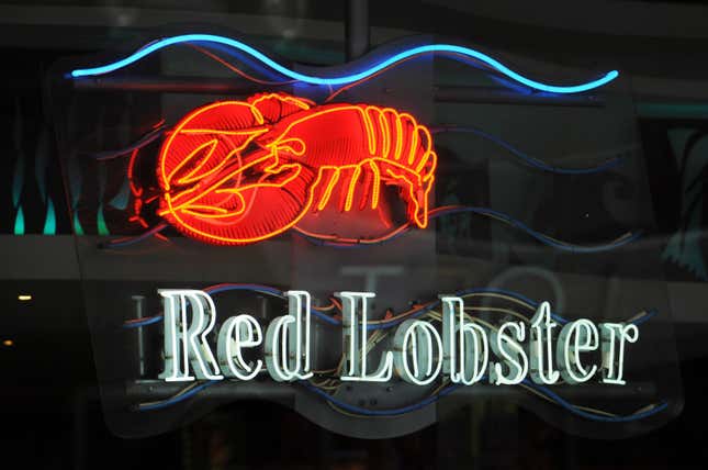 A neon sign of Red Lobster. 