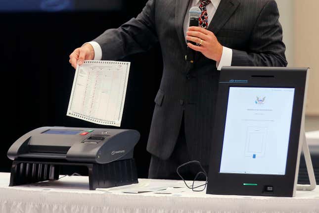 FILE - A Smartmatic representative demonstrates his company&#39;s system, which has scanners and touch screens with printout options, at a meeting of the Secure, Accessible &amp; Fair Elections Commission, Aug. 30, 2018, in Grovetown, Ga. On Tuesday, Jan. 23, 2024, a judge refused to toss out Fox News&#39; claims that voting technology company Smartmatic is suing the network to suppress free speech, meaning that both Smartmatic&#39;s multibillion-dollar defamation lawsuit and the network&#39;s counterclaims can continue toward an eventual trial. (Bob Andres/Atlanta Journal-Constitution via AP, File)