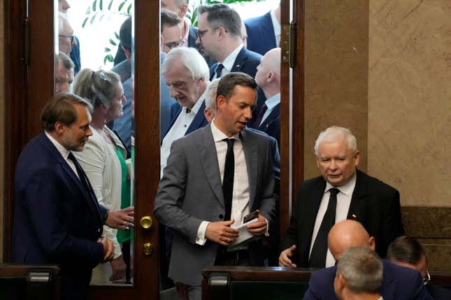 The leader of Poland&#39;s ruling party Jaroslaw Kaczynski ,right, during parliament vote to confirm that a government-planned controversial referendum on migration will be held alongside key parliamentary elections on Oct. 15, at the lower house of parliament in Warsaw, Poland, on Thursday, Aug. 2023. Critics say the referendum is a campaign ploy by ruling Law and Justice party to discredit the opposition and rally voters around government politics. (AP Photo/Czarek Sokolowski)