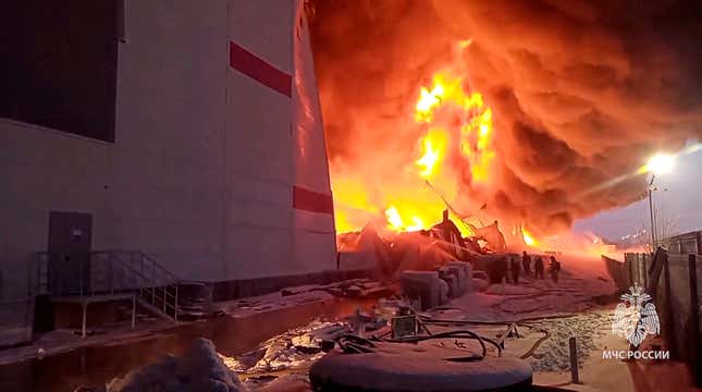 In this photo released by Russian Emergency Ministry Press Service on Saturday, Jan. 13, 2024, Russian Emergency Situations Ministry firefighters work at the side of the warehouse in St. Petersburg, Russia. Russian authorities say that a huge fire tore through a large warehouse used by Russia&#39;s largest online retailer south of St. Petersburg. Russia&#39;s Emergency Situations Ministry said the fire covered an area of 70,000 square meters with 50,000 square meters of the warehouse collapsing. No casualties were reported. (Russian Emergency Ministry Press Service via AP)