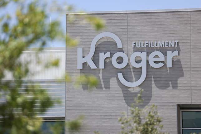 Trucks wait outside Kroger&#39;s fulfillment center, July 27, 2022 in Dallas, Texas. Kroger is shuttering three of its e-commerce fulfillment facilities in Texas and Florida. The cross-docking warehouses — located in Austin, San Antonio and Miami — will be closed at the end of May, according to a Kroger spokesperson, who added that all impacted associates had been offered other opportunities within the company. (Rebecca Slezak/The Dallas Morning News via AP, file)