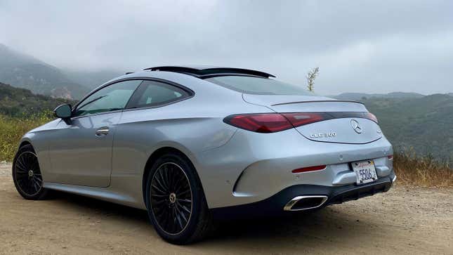 A rear 3/4 shot of the CLE parked in front of a cloudy mountain vista