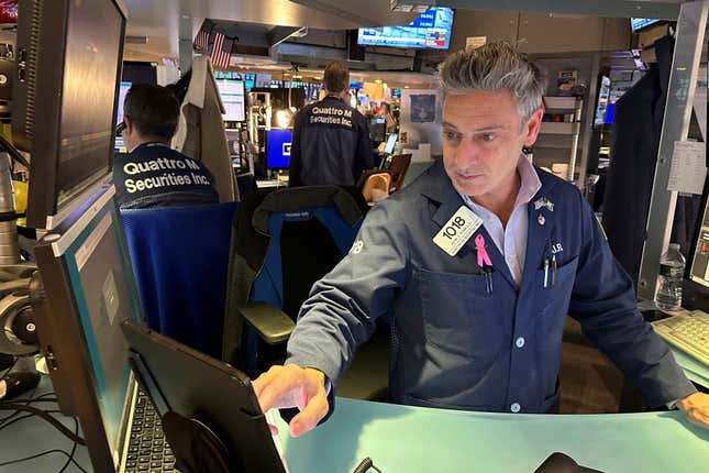 File - Traders work on the New York Stock Exchange floor in New York on November 3, 2023. Wall Street is mixed early Friday after closing out the best month of the year. (AP Photo/Ted Shaffrey, File)