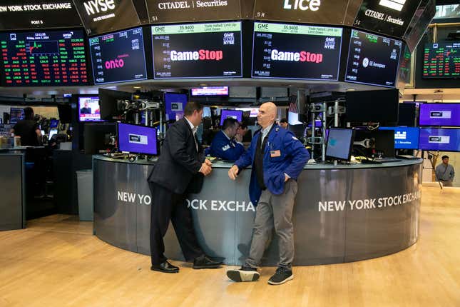 Traders work as GameStop Corp. shares are halted on the floor of the NYSE in New York on Friday, June 7, 2024.